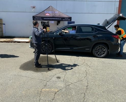 Man Shooting picture of delivering in Greater Vancouver, BC 