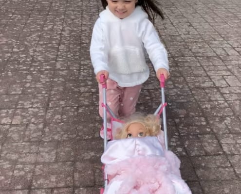 Little girl with her doll